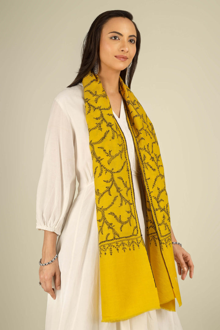 Yellow Kashmiri pure pashmina embroidered stole by Kepra, draped on smiling model in white dress, full-length front view for London winter styling
    
      | pashmina shawls online | authentic Kashmiri pashmina shawl online | pure pashmina shawl online | original GI certified pashmina shawl online | luxury men's pashmina shawl online from Kashmir | where to buy online pure pashmina in India
    
    | GI Tag Certified - Government-verified authentic Kashmiri Pashmina
    | G20 Official Partner - Selected by India for G20 Summit gifting
    | Handicraft Registered - Official recognition of traditional craftsmanship
    | Certificate of Authenticity - Every purchase includes GI certification