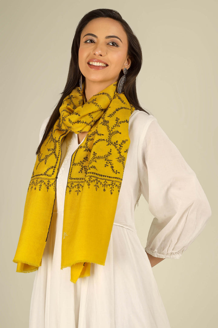 Yellow Kashmiri pure pashmina embroidered stole by Kepra, draped on smiling model in white dress, full-length front view for London winter styling
    
      | pashmina shawls online | authentic Kashmiri pashmina shawl online | pure pashmina shawl online | original GI certified pashmina shawl online | luxury men's pashmina shawl online from Kashmir | where to buy online pure pashmina in India
    
    | GI Tag Certified - Government-verified authentic Kashmiri Pashmina
    | G20 Official Partner - Selected by India for G20 Summit gifting
    | Handicraft Registered - Official recognition of traditional craftsmanship
    | Certificate of Authenticity - Every purchase includes GI certification