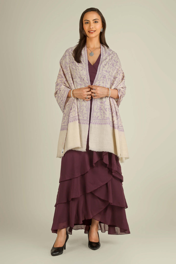 Ivory GI Kashmiri pure pashmina embroidered stole with lilac floral vines by Kepra, draped on model over plum dress, front view for Zurich winter styling
    
      | pashmina shawls online | authentic Kashmiri pashmina shawl online | pure pashmina shawl online | original GI certified pashmina shawl online | luxury men's pashmina shawl online from Kashmir | where to buy online pure pashmina in India
    
    | GI Tag Certified - Government-verified authentic Kashmiri Pashmina
    | G20 Official Partner - Selected by India for G20 Summit gifting
    | Handicraft Registered - Official recognition of traditional craftsmanship
    | Certificate of Authenticity - Every purchase includes GI certification