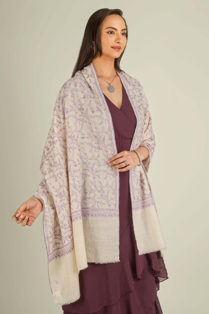 Ivory GI Kashmiri pure pashmina embroidered stole with lilac floral vines by Kepra, draped on model over plum dress, front view for Zurich winter styling
    
      | pashmina shawls online | authentic Kashmiri pashmina shawl online | pure pashmina shawl online | original GI certified pashmina shawl online | luxury men's pashmina shawl online from Kashmir | where to buy online pure pashmina in India
    
    | GI Tag Certified - Government-verified authentic Kashmiri Pashmina
    | G20 Official Partner - Selected by India for G20 Summit gifting
    | Handicraft Registered - Official recognition of traditional craftsmanship
    | Certificate of Authenticity - Every purchase includes GI certification