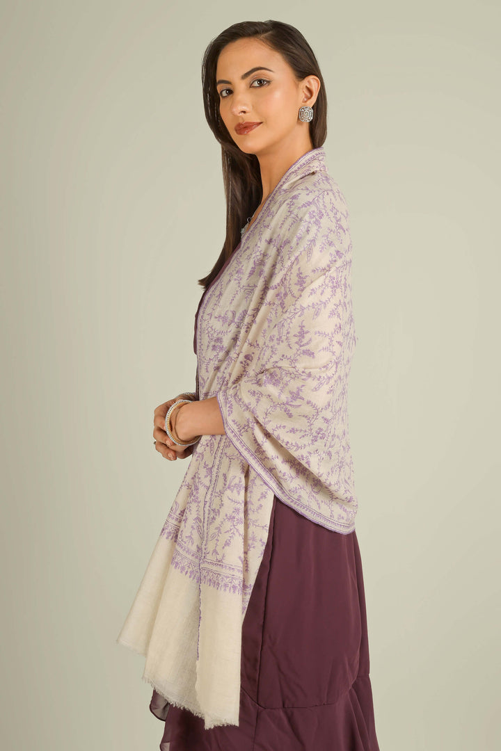 Ivory GI Kashmiri pure pashmina embroidered stole with lilac floral vines by Kepra, draped on model over plum dress, front view for Zurich winter styling
    
      | pashmina shawls online | authentic Kashmiri pashmina shawl online | pure pashmina shawl online | original GI certified pashmina shawl online | luxury men's pashmina shawl online from Kashmir | where to buy online pure pashmina in India
    
    | GI Tag Certified - Government-verified authentic Kashmiri Pashmina
    | G20 Official Partner - Selected by India for G20 Summit gifting
    | Handicraft Registered - Official recognition of traditional craftsmanship
    | Certificate of Authenticity - Every purchase includes GI certification
