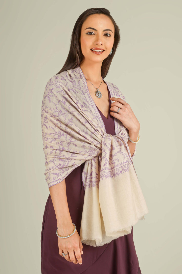 Ivory GI Kashmiri pure pashmina embroidered stole with lilac floral vines by Kepra, draped on model over plum dress, front view for Zurich winter styling
    
      | pashmina shawls online | authentic Kashmiri pashmina shawl online | pure pashmina shawl online | original GI certified pashmina shawl online | luxury men's pashmina shawl online from Kashmir | where to buy online pure pashmina in India
    
    | GI Tag Certified - Government-verified authentic Kashmiri Pashmina
    | G20 Official Partner - Selected by India for G20 Summit gifting
    | Handicraft Registered - Official recognition of traditional craftsmanship
    | Certificate of Authenticity - Every purchase includes GI certification