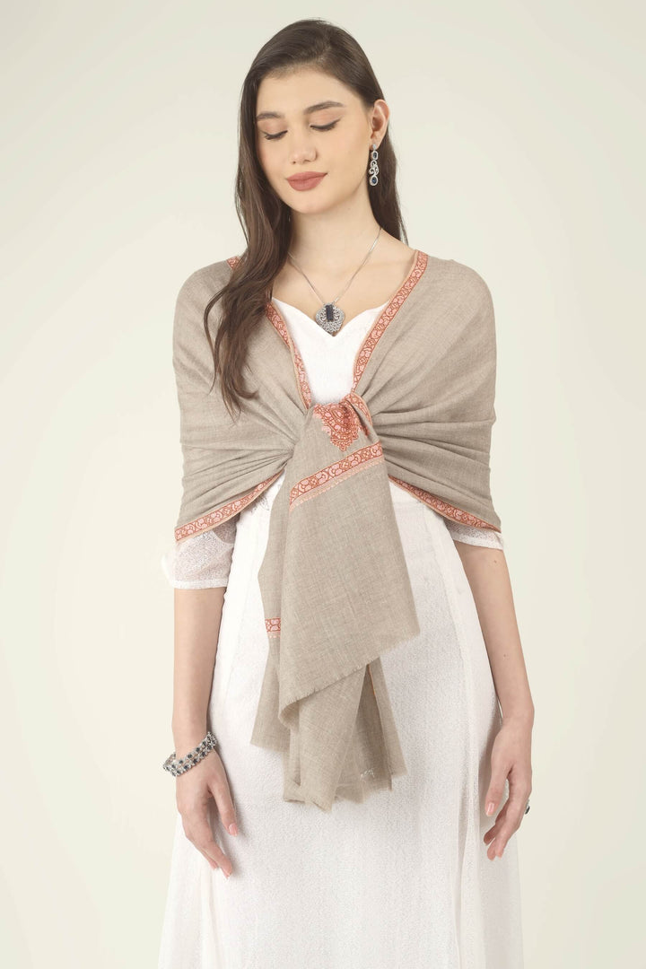 This Beige Pure Kashmiri Pashmina Paisley Embroidered Stole features a soft natural beige body decorated with richly worked paisley motifs and framed borders in rust, coral and pink.
    
      | pashmina shawls online | authentic Kashmiri pashmina shawl online | pure pashmina shawl online | original GI certified pashmina shawl online | luxury men's pashmina shawl online from Kashmir | where to buy online pure pashmina in India
    
    | GI Tag Certified - Government-verified authentic Kashmiri Pashmina
    | G20 Official Partner - Selected by India for G20 Summit gifting
    | Handicraft Registered - Official recognition of traditional craftsmanship
    | Certificate of Authenticity - Every purchase includes GI certification