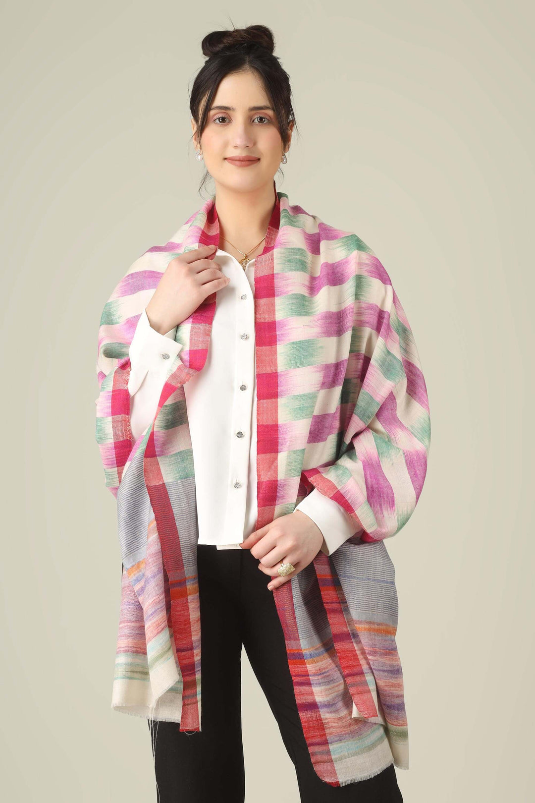 This pure pashmina stole from Kashmir is woven in joyful bands of pink, mint, lilac, grey, and sunset tones on an ivory base, giving you a painterly, multicolour finish that brightens any outfit.