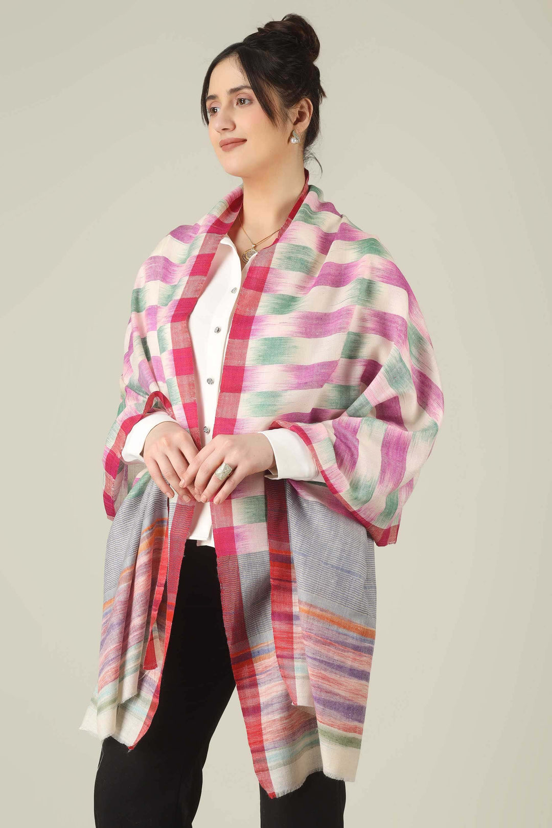 This pure pashmina stole from Kashmir is woven in joyful bands of pink, mint, lilac, grey, and sunset tones on an ivory base, giving you a painterly, multicolour finish that brightens any outfit.