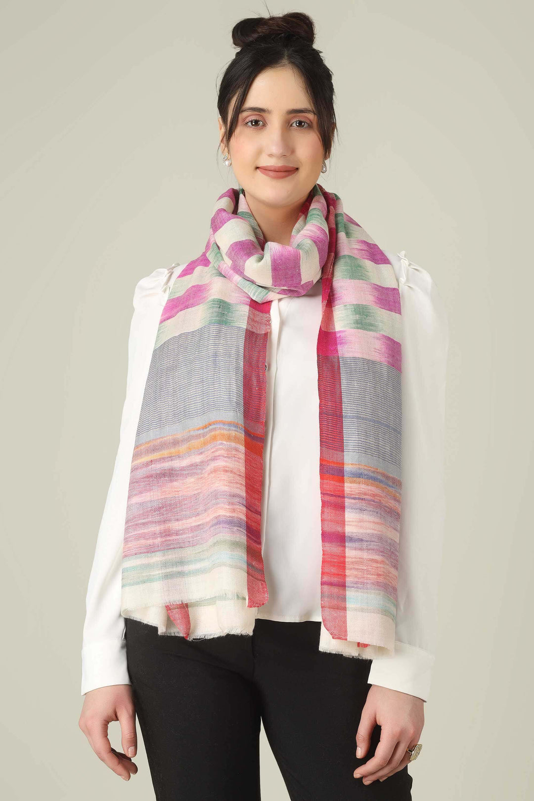 This pure pashmina stole from Kashmir is woven in joyful bands of pink, mint, lilac, grey, and sunset tones on an ivory base, giving you a painterly, multicolour finish that brightens any outfit.