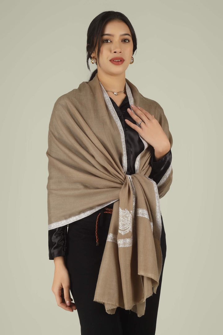 Hand-embroidered natural taupe pure Pashmina stole featuring ivory Sozni corner paisley motifs and a delicate Hashidaar border from Kepra.
    
      | pashmina shawls online | authentic Kashmiri pashmina shawl online | pure pashmina shawl online | original GI certified pashmina shawl online | luxury men's pashmina shawl online from Kashmir | where to buy online pure pashmina in India
    
    | GI Tag Certified - Government-verified authentic Kashmiri Pashmina
    | G20 Official Partner - Selected by India for G20 Summit gifting
    | Handicraft Registered - Official recognition of traditional craftsmanship
    | Certificate of Authenticity - Every purchase includes GI certification