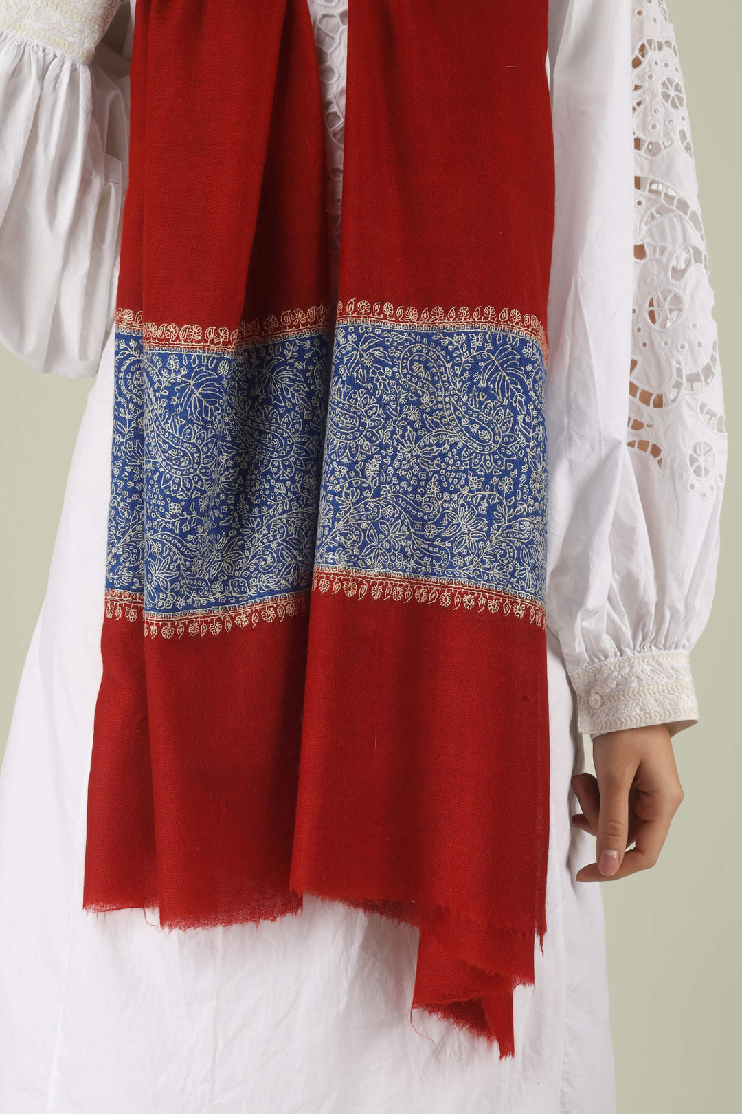 Hand-embroidered ruby red pure Pashmina stole with royal blue Paladaar panels and ivory Sozni needlework from Kepra.