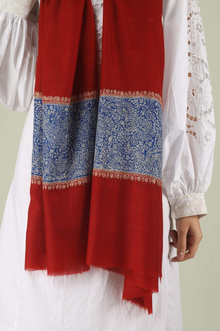 Hand-embroidered ruby red pure Pashmina stole with royal blue Paladaar panels and ivory Sozni needlework from Kepra.
    
      | pashmina shawls online | authentic Kashmiri pashmina shawl online | pure pashmina shawl online | original GI certified pashmina shawl online | luxury men's pashmina shawl online from Kashmir | where to buy online pure pashmina in India
    
    | GI Tag Certified - Government-verified authentic Kashmiri Pashmina
    | G20 Official Partner - Selected by India for G20 Summit gifting
    | Handicraft Registered - Official recognition of traditional craftsmanship
    | Certificate of Authenticity - Every purchase includes GI certification