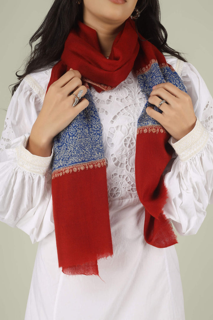 Hand-embroidered ruby red pure Pashmina stole with royal blue Paladaar panels and ivory Sozni needlework from Kepra.
    
      | pashmina shawls online | authentic Kashmiri pashmina shawl online | pure pashmina shawl online | original GI certified pashmina shawl online | luxury men's pashmina shawl online from Kashmir | where to buy online pure pashmina in India
    
    | GI Tag Certified - Government-verified authentic Kashmiri Pashmina
    | G20 Official Partner - Selected by India for G20 Summit gifting
    | Handicraft Registered - Official recognition of traditional craftsmanship
    | Certificate of Authenticity - Every purchase includes GI certification