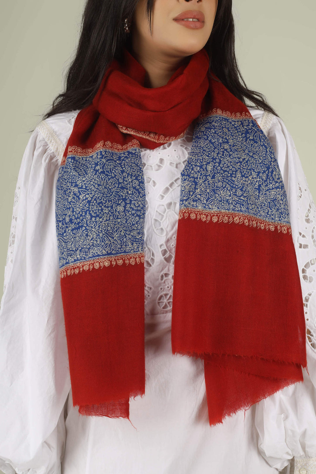 Hand-embroidered ruby red pure Pashmina stole with royal blue Paladaar panels and ivory Sozni needlework from Kepra.