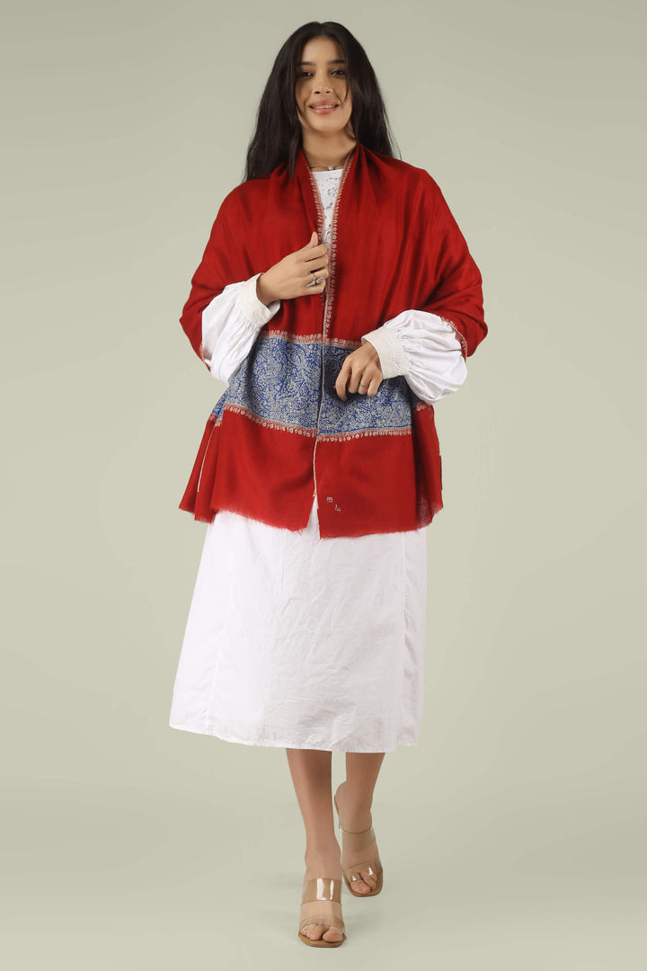 Hand-embroidered ruby red pure Pashmina stole with royal blue Paladaar panels and ivory Sozni needlework from Kepra.
    
      | pashmina shawls online | authentic Kashmiri pashmina shawl online | pure pashmina shawl online | original GI certified pashmina shawl online | luxury men's pashmina shawl online from Kashmir | where to buy online pure pashmina in India
    
    | GI Tag Certified - Government-verified authentic Kashmiri Pashmina
    | G20 Official Partner - Selected by India for G20 Summit gifting
    | Handicraft Registered - Official recognition of traditional craftsmanship
    | Certificate of Authenticity - Every purchase includes GI certification