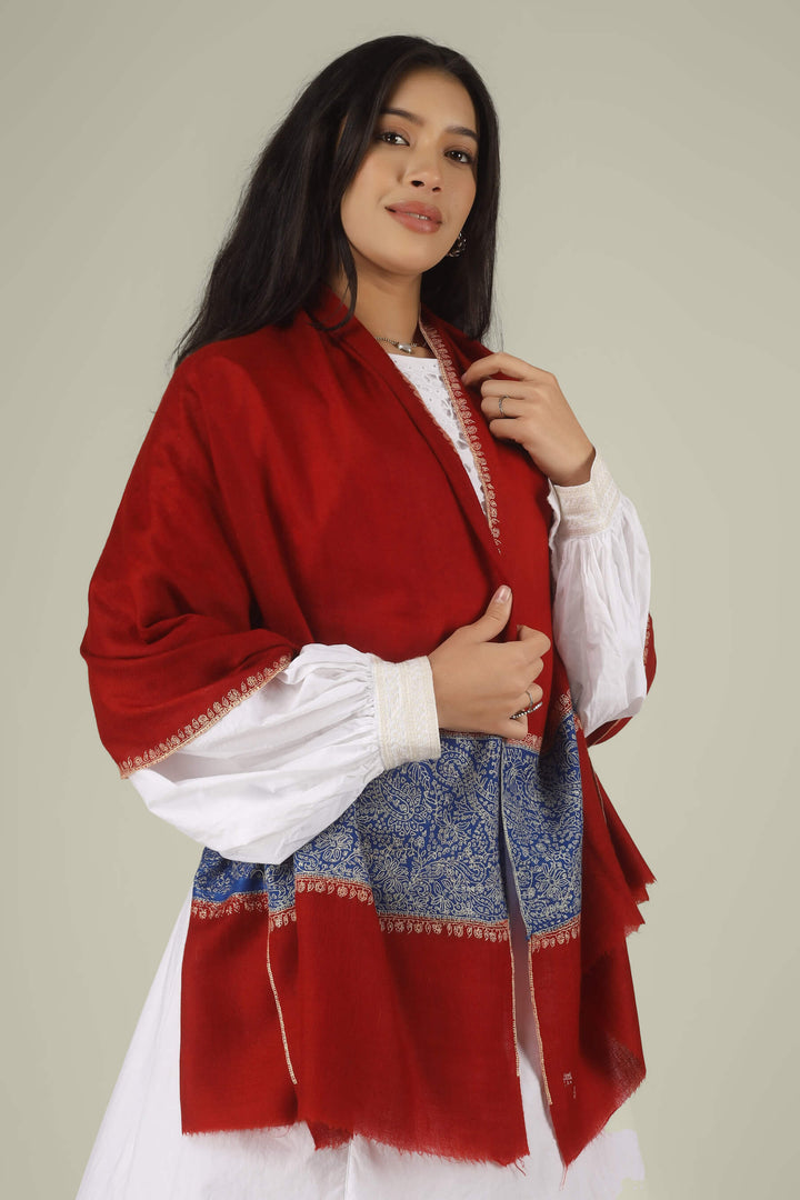 Hand-embroidered ruby red pure Pashmina stole with royal blue Paladaar panels and ivory Sozni needlework from Kepra.
    
      | pashmina shawls online | authentic Kashmiri pashmina shawl online | pure pashmina shawl online | original GI certified pashmina shawl online | luxury men's pashmina shawl online from Kashmir | where to buy online pure pashmina in India
    
    | GI Tag Certified - Government-verified authentic Kashmiri Pashmina
    | G20 Official Partner - Selected by India for G20 Summit gifting
    | Handicraft Registered - Official recognition of traditional craftsmanship
    | Certificate of Authenticity - Every purchase includes GI certification