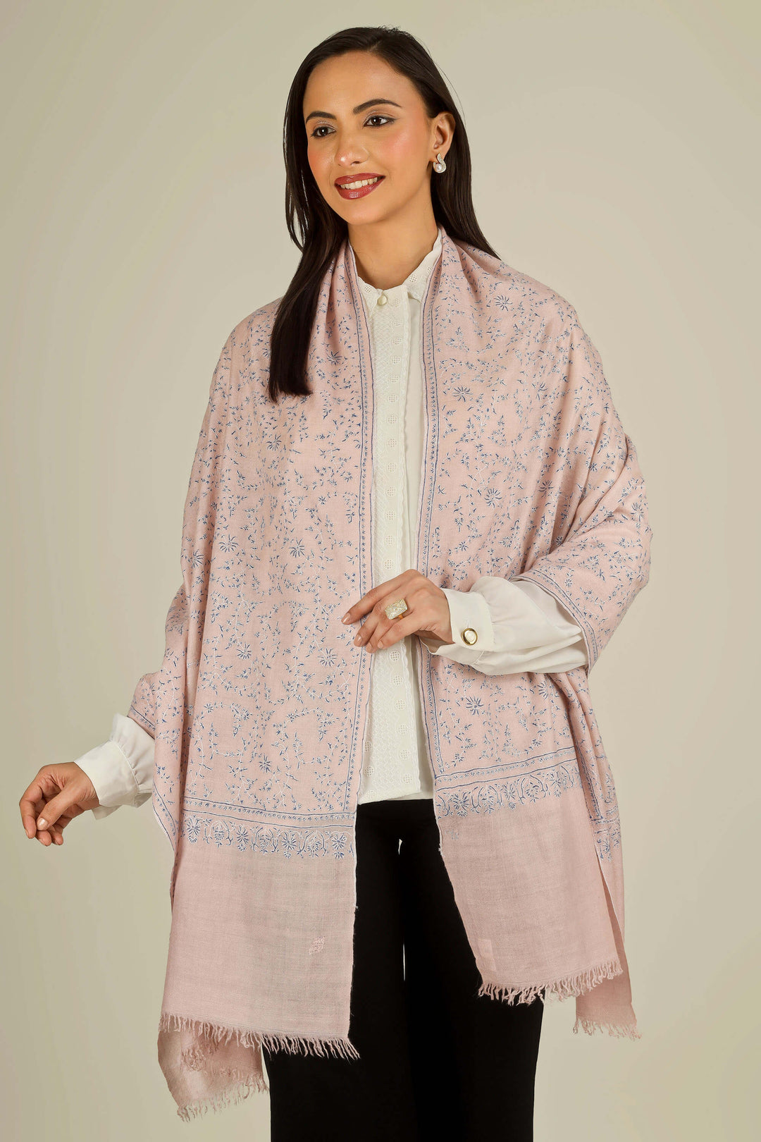 Pink Kashmiri pure pashmina embroidered stole by Kepra, draped on smiling model over white shirt and black trousers, front view