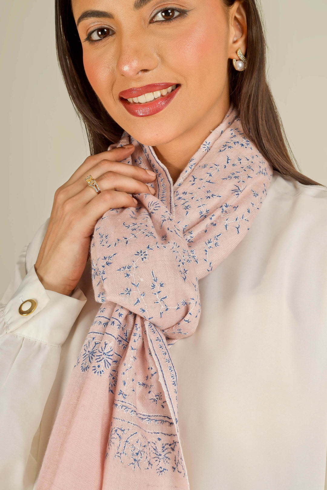 Pink Kashmiri pure pashmina embroidered stole by Kepra, draped on smiling model over white shirt and black trousers, front view