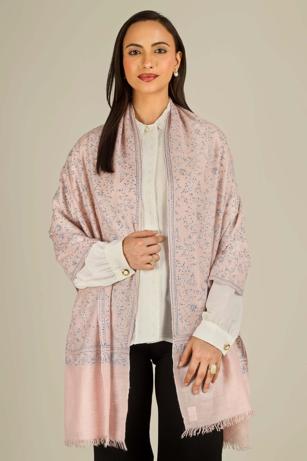Pink Kashmiri pure pashmina embroidered stole by Kepra, draped on smiling model over white shirt and black trousers, front view