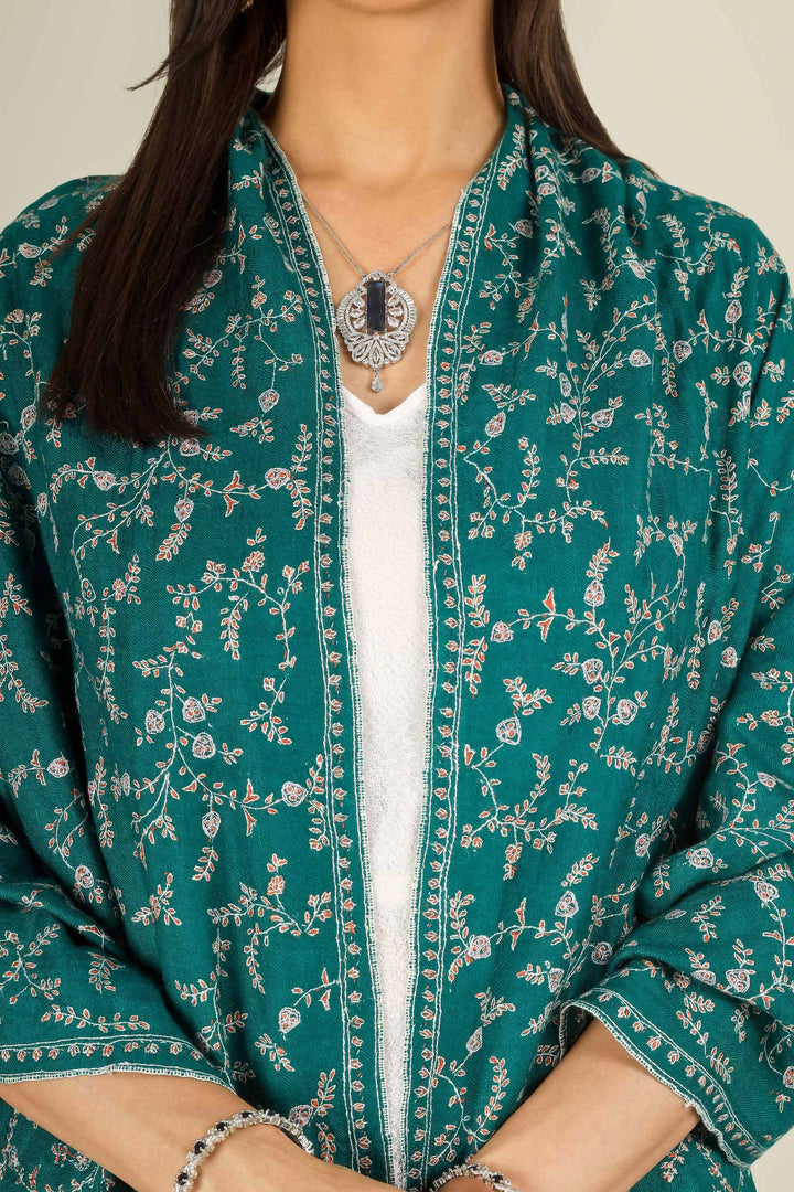 GI teal Kashmiri pure pashmina embroidered stole by Kepra, draped on smiling model in white dress, front view for Paris winter styling
    
      | pashmina shawls online | authentic Kashmiri pashmina shawl online | pure pashmina shawl online | original GI certified pashmina shawl online | luxury men's pashmina shawl online from Kashmir | where to buy online pure pashmina in India
    
    | GI Tag Certified - Government-verified authentic Kashmiri Pashmina
    | G20 Official Partner - Selected by India for G20 Summit gifting
    | Handicraft Registered - Official recognition of traditional craftsmanship
    | Certificate of Authenticity - Every purchase includes GI certification