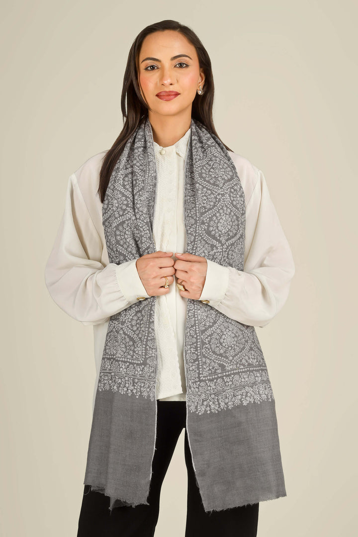 GI grey Kashmiri pure pashmina embroidered stole by Kepra, draped on smiling model over white shirt and black trousers, front view
    
      | pashmina shawls online | authentic Kashmiri pashmina shawl online | pure pashmina shawl online | original GI certified pashmina shawl online | luxury men's pashmina shawl online from Kashmir | where to buy online pure pashmina in India
    
    | GI Tag Certified - Government-verified authentic Kashmiri Pashmina
    | G20 Official Partner - Selected by India for G20 Summit gifting
    | Handicraft Registered - Official recognition of traditional craftsmanship
    | Certificate of Authenticity - Every purchase includes GI certification