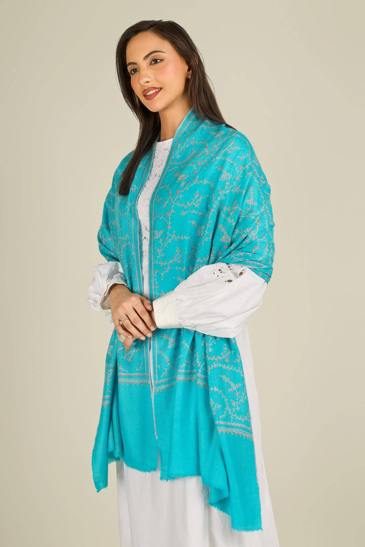 This GI Turquoise Kashmiri Pure Pashmina Embroidered Stole is a bright, refreshing accessory, handwoven in Kashmir and patterned with delicate all-over vines that frame the edges and flow softly along the length of the fabric.
    
      | pashmina shawls online | authentic Kashmiri pashmina shawl online | pure pashmina shawl online | original GI certified pashmina shawl online | luxury men's pashmina shawl online from Kashmir | where to buy online pure pashmina in India
    
    | GI Tag Certified - Government-verified authentic Kashmiri Pashmina
    | G20 Official Partner - Selected by India for G20 Summit gifting
    | Handicraft Registered - Official recognition of traditional craftsmanship
    | Certificate of Authenticity - Every purchase includes GI certification