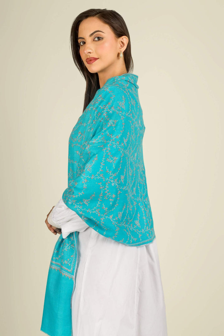 This GI Turquoise Kashmiri Pure Pashmina Embroidered Stole is a bright, refreshing accessory, handwoven in Kashmir and patterned with delicate all-over vines that frame the edges and flow softly along the length of the fabric.
    
      | pashmina shawls online | authentic Kashmiri pashmina shawl online | pure pashmina shawl online | original GI certified pashmina shawl online | luxury men's pashmina shawl online from Kashmir | where to buy online pure pashmina in India
    
    | GI Tag Certified - Government-verified authentic Kashmiri Pashmina
    | G20 Official Partner - Selected by India for G20 Summit gifting
    | Handicraft Registered - Official recognition of traditional craftsmanship
    | Certificate of Authenticity - Every purchase includes GI certification