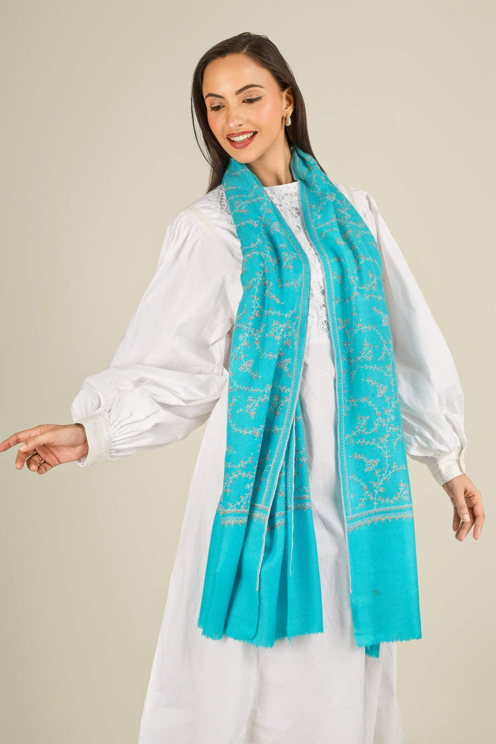 This GI Turquoise Kashmiri Pure Pashmina Embroidered Stole is a bright, refreshing accessory, handwoven in Kashmir and patterned with delicate all-over vines that frame the edges and flow softly along the length of the fabric.
    
      | pashmina shawls online | authentic Kashmiri pashmina shawl online | pure pashmina shawl online | original GI certified pashmina shawl online | luxury men's pashmina shawl online from Kashmir | where to buy online pure pashmina in India
    
    | GI Tag Certified - Government-verified authentic Kashmiri Pashmina
    | G20 Official Partner - Selected by India for G20 Summit gifting
    | Handicraft Registered - Official recognition of traditional craftsmanship
    | Certificate of Authenticity - Every purchase includes GI certification