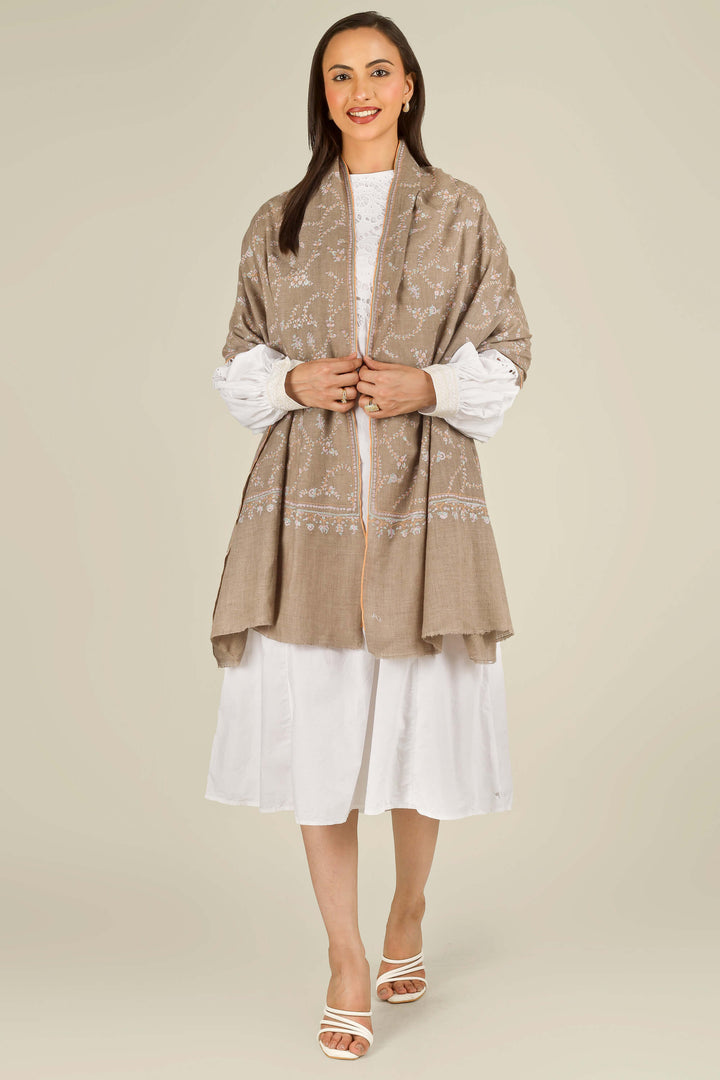 GI taupe Kashmiri pure pashmina embroidered stole by Kepra, draped over white dress on smiling model, front view
    
      | pashmina shawls online | authentic Kashmiri pashmina shawl online | pure pashmina shawl online | original GI certified pashmina shawl online | luxury men's pashmina shawl online from Kashmir | where to buy online pure pashmina in India
    
    | GI Tag Certified - Government-verified authentic Kashmiri Pashmina
    | G20 Official Partner - Selected by India for G20 Summit gifting
    | Handicraft Registered - Official recognition of traditional craftsmanship
    | Certificate of Authenticity - Every purchase includes GI certification