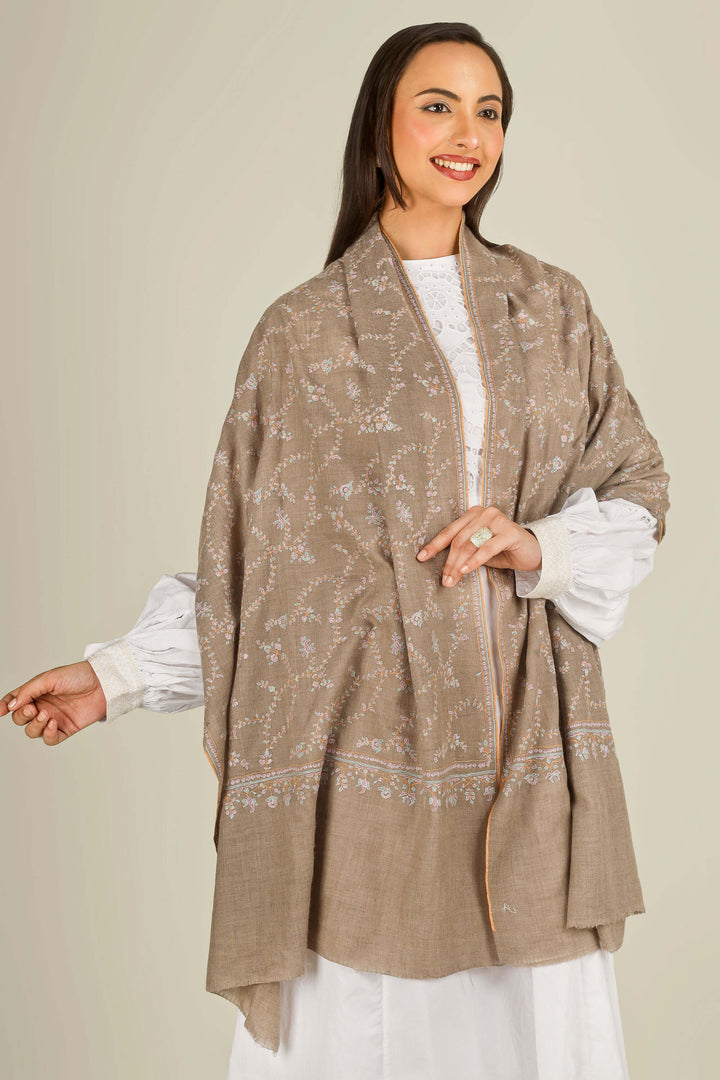GI taupe Kashmiri pure pashmina embroidered stole by Kepra, draped over white dress on smiling model, front view
    
      | pashmina shawls online | authentic Kashmiri pashmina shawl online | pure pashmina shawl online | original GI certified pashmina shawl online | luxury men's pashmina shawl online from Kashmir | where to buy online pure pashmina in India
    
    | GI Tag Certified - Government-verified authentic Kashmiri Pashmina
    | G20 Official Partner - Selected by India for G20 Summit gifting
    | Handicraft Registered - Official recognition of traditional craftsmanship
    | Certificate of Authenticity - Every purchase includes GI certification