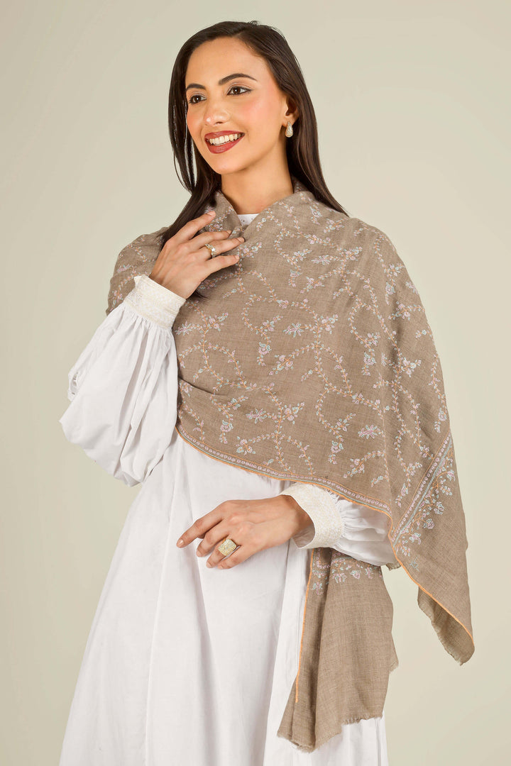 GI taupe Kashmiri pure pashmina embroidered stole by Kepra, draped over white dress on smiling model, front view
    
      | pashmina shawls online | authentic Kashmiri pashmina shawl online | pure pashmina shawl online | original GI certified pashmina shawl online | luxury men's pashmina shawl online from Kashmir | where to buy online pure pashmina in India
    
    | GI Tag Certified - Government-verified authentic Kashmiri Pashmina
    | G20 Official Partner - Selected by India for G20 Summit gifting
    | Handicraft Registered - Official recognition of traditional craftsmanship
    | Certificate of Authenticity - Every purchase includes GI certification