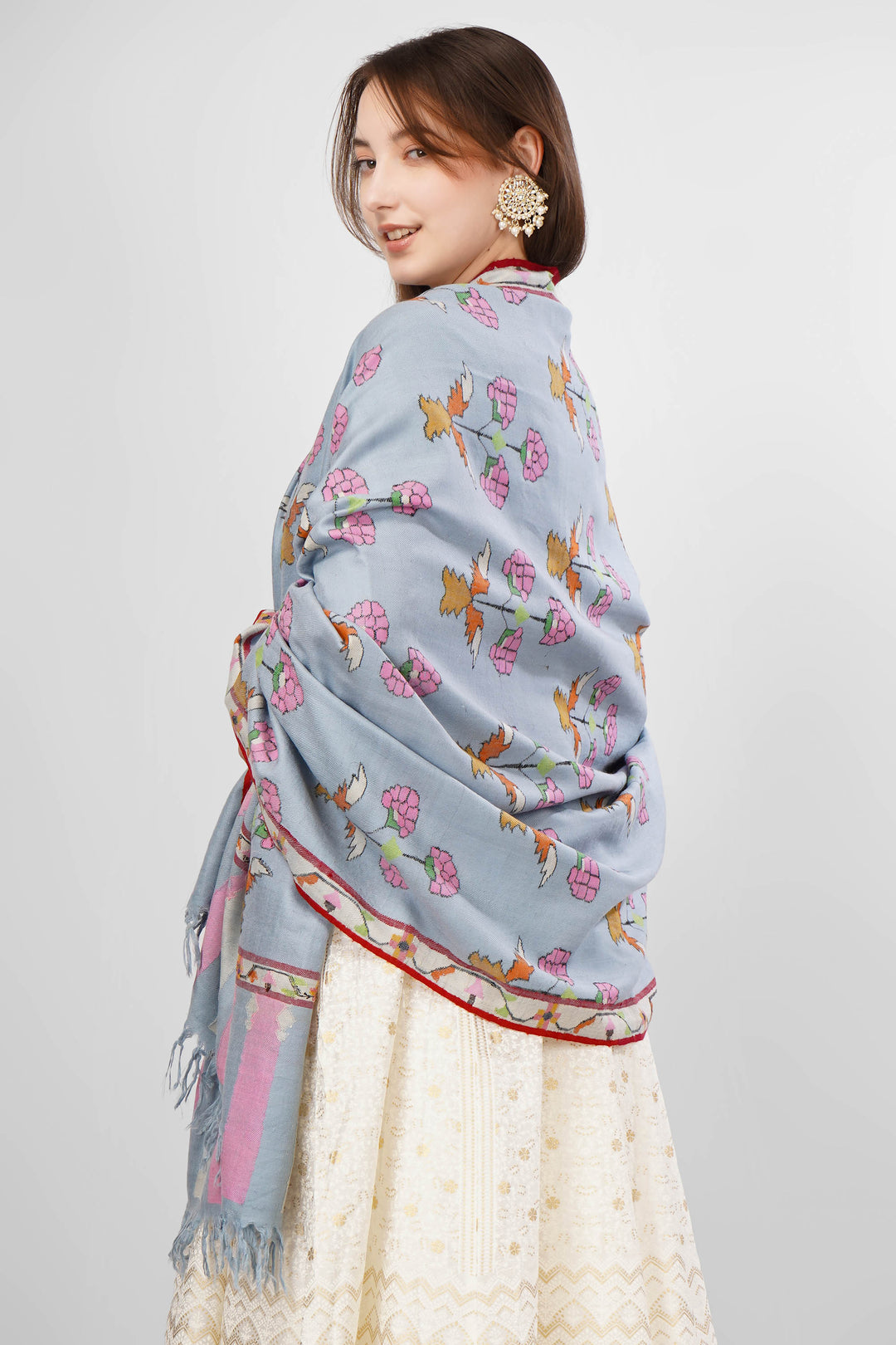 Pastel Blue GI-Tagged Pashmina Kani Shawl Online , The GI tag is your guarantee that this shawl is made by Kashmiri artisans using genuine pashmina wool spun and woven by hand, and not a machine-made imitation. It protects the traditional craft