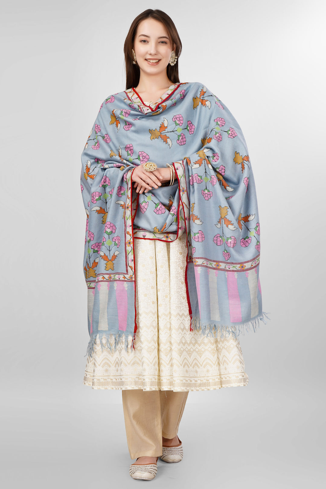 Pastel Blue GI-Tagged Pashmina Kani Shawl Online , The GI tag is your guarantee that this shawl is made by Kashmiri artisans using genuine pashmina wool spun and woven by hand, and not a machine-made imitation. It protects the traditional craft