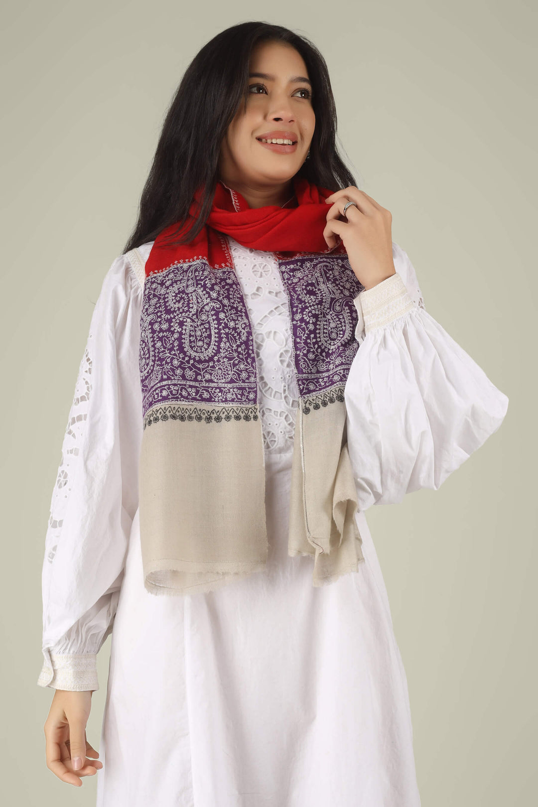 Hand-embroidered ruby red and natural beige dual-tone pure Pashmina stole featuring a broad purple Sozni embroidery band with ivory paisley motifs from Kepra.