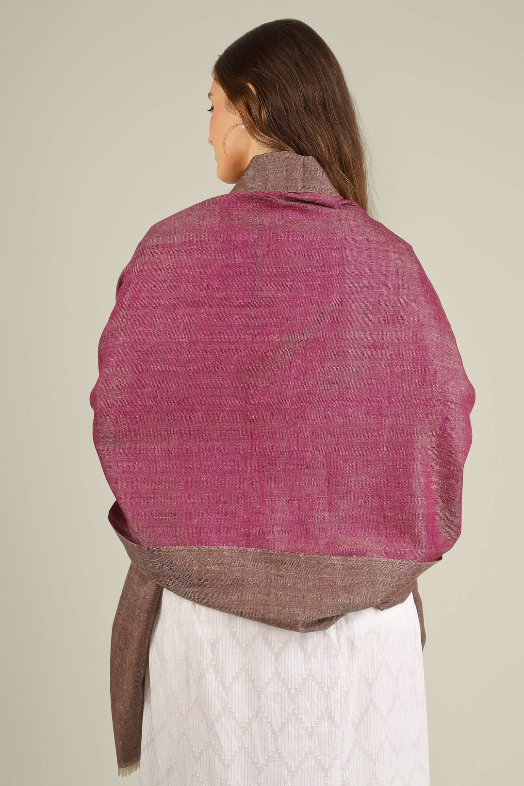 This reversible pashmina shawl features a luxurious two-tone palette, with muted rose on one side and soft mocha brown on the other, allowing you to switch moods with a simple flip
