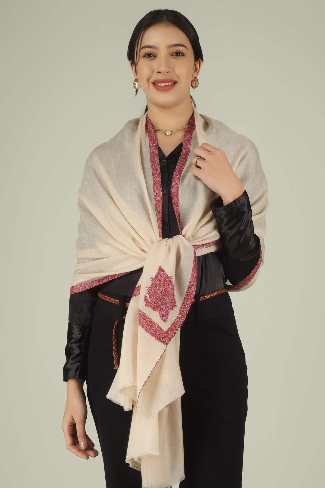 Hand-embroidered off-white pure Pashmina stole featuring pink and rust Sozni paisley (Buta) motifs and a delicate Hashidaar border from Kepra.