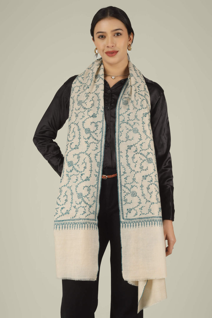 Hand-embroidered ivory off-white pure Pashmina stole featuring an all-over teal Sozni Jaldaar floral vine pattern from Kepra.
    
      | pashmina shawls online | authentic Kashmiri pashmina shawl online | pure pashmina shawl online | original GI certified pashmina shawl online | luxury men's pashmina shawl online from Kashmir | where to buy online pure pashmina in India
    
    | GI Tag Certified - Government-verified authentic Kashmiri Pashmina
    | G20 Official Partner - Selected by India for G20 Summit gifting
    | Handicraft Registered - Official recognition of traditional craftsmanship
    | Certificate of Authenticity - Every purchase includes GI certification