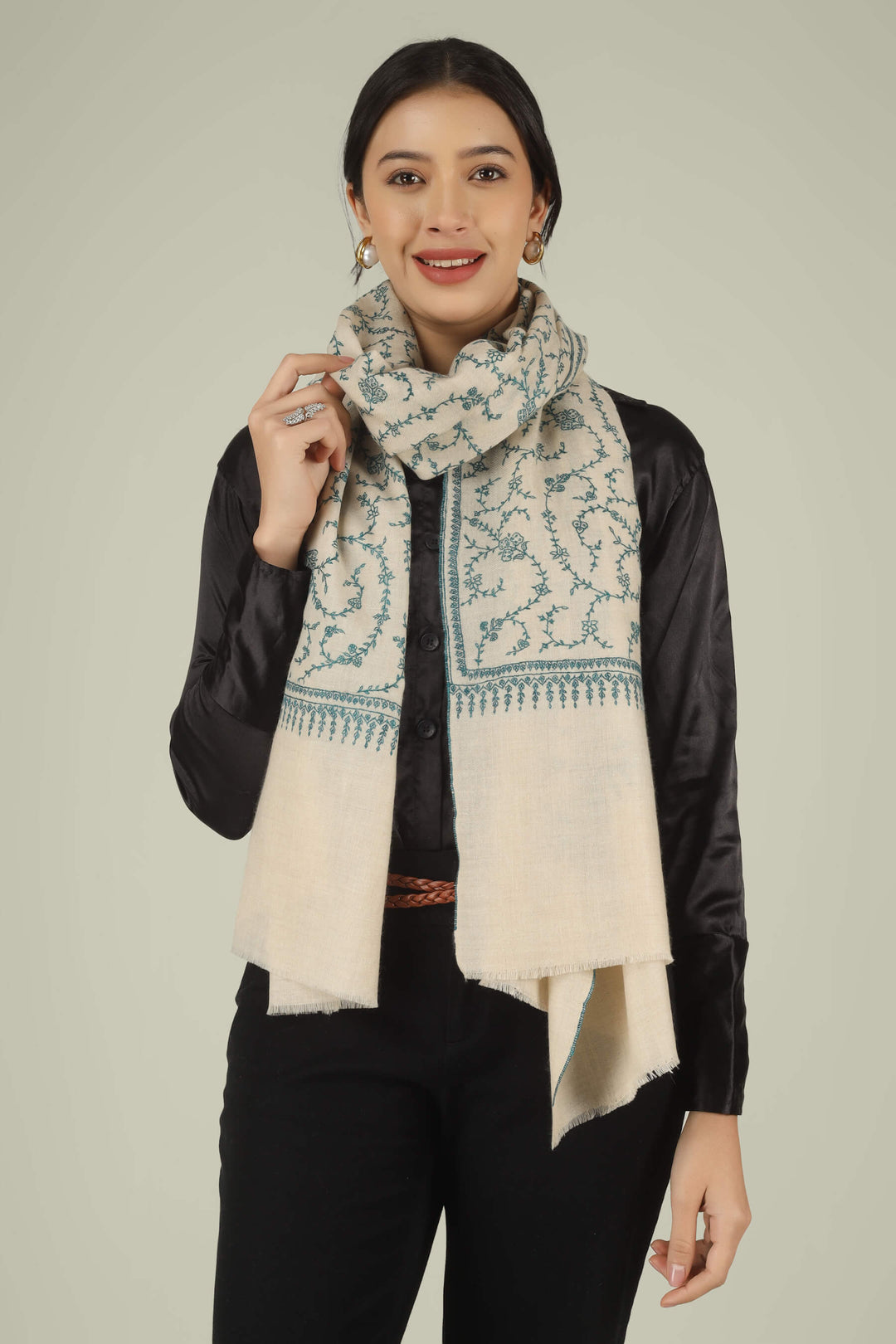 Hand-embroidered ivory off-white pure Pashmina stole featuring an all-over teal Sozni Jaldaar floral vine pattern from Kepra.