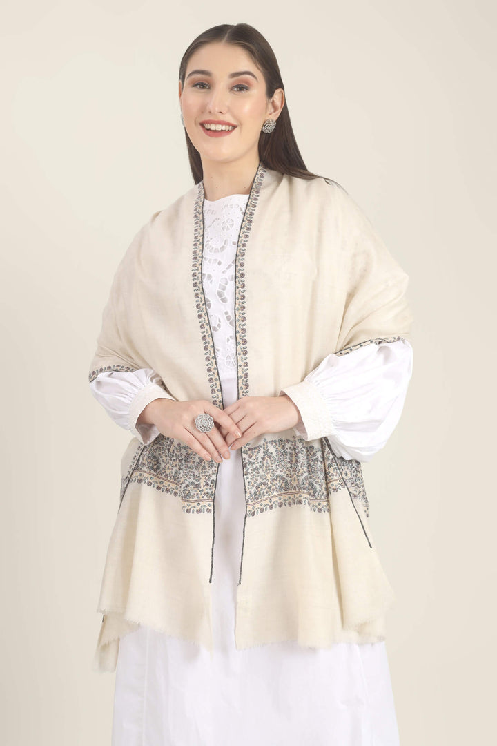 Model wearing a white GI Kashmiri Pure Pashmina stole with multicolour floral Sozni embroidered borders over a white outfit.
    
      | pashmina shawls online | authentic Kashmiri pashmina shawl online | pure pashmina shawl online | original GI certified pashmina shawl online | luxury men's pashmina shawl online from Kashmir | where to buy online pure pashmina in India
    
    | GI Tag Certified - Government-verified authentic Kashmiri Pashmina
    | G20 Official Partner - Selected by India for G20 Summit gifting
    | Handicraft Registered - Official recognition of traditional craftsmanship
    | Certificate of Authenticity - Every purchase includes GI certification