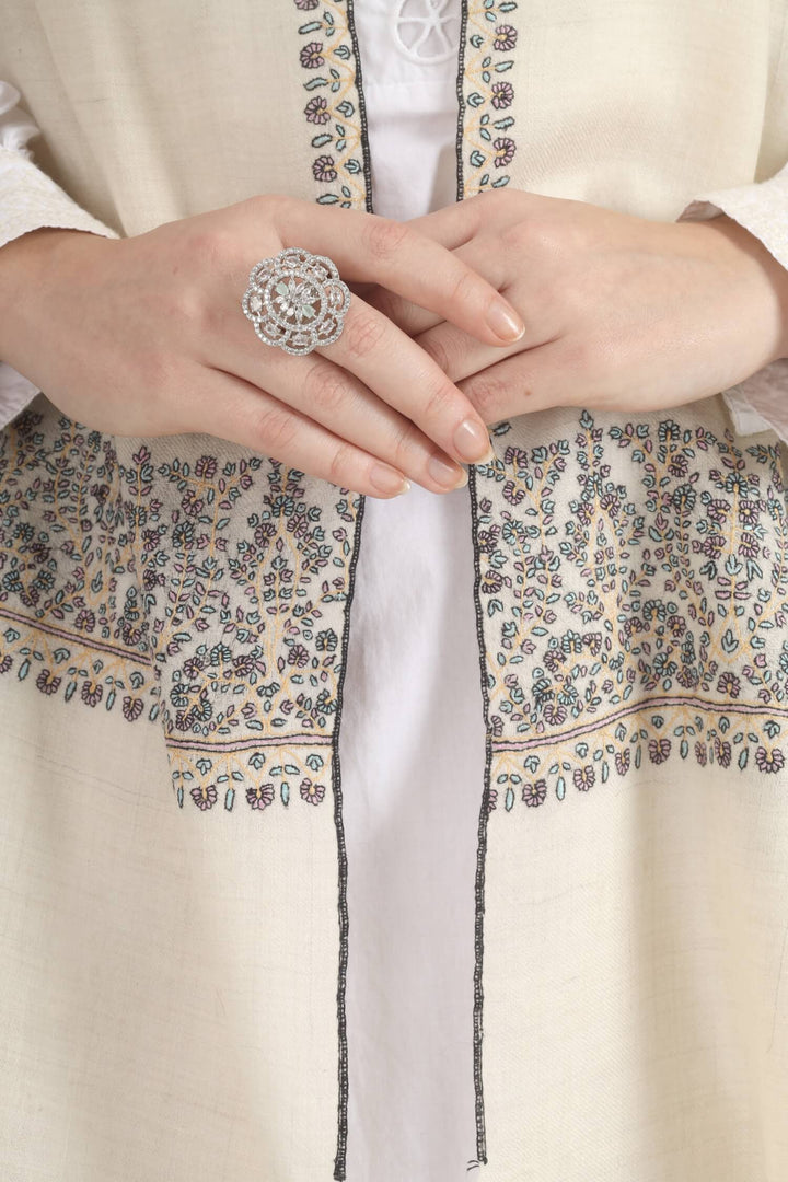 Model wearing a white GI Kashmiri Pure Pashmina stole with multicolour floral Sozni embroidered borders over a white outfit.
    
      | pashmina shawls online | authentic Kashmiri pashmina shawl online | pure pashmina shawl online | original GI certified pashmina shawl online | luxury men's pashmina shawl online from Kashmir | where to buy online pure pashmina in India
    
    | GI Tag Certified - Government-verified authentic Kashmiri Pashmina
    | G20 Official Partner - Selected by India for G20 Summit gifting
    | Handicraft Registered - Official recognition of traditional craftsmanship
    | Certificate of Authenticity - Every purchase includes GI certification