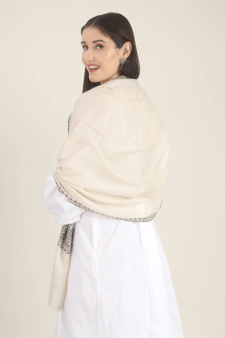 Model wearing a white GI Kashmiri Pure Pashmina stole with multicolour floral Sozni embroidered borders over a white outfit.
    
      | pashmina shawls online | authentic Kashmiri pashmina shawl online | pure pashmina shawl online | original GI certified pashmina shawl online | luxury men's pashmina shawl online from Kashmir | where to buy online pure pashmina in India
    
    | GI Tag Certified - Government-verified authentic Kashmiri Pashmina
    | G20 Official Partner - Selected by India for G20 Summit gifting
    | Handicraft Registered - Official recognition of traditional craftsmanship
    | Certificate of Authenticity - Every purchase includes GI certification