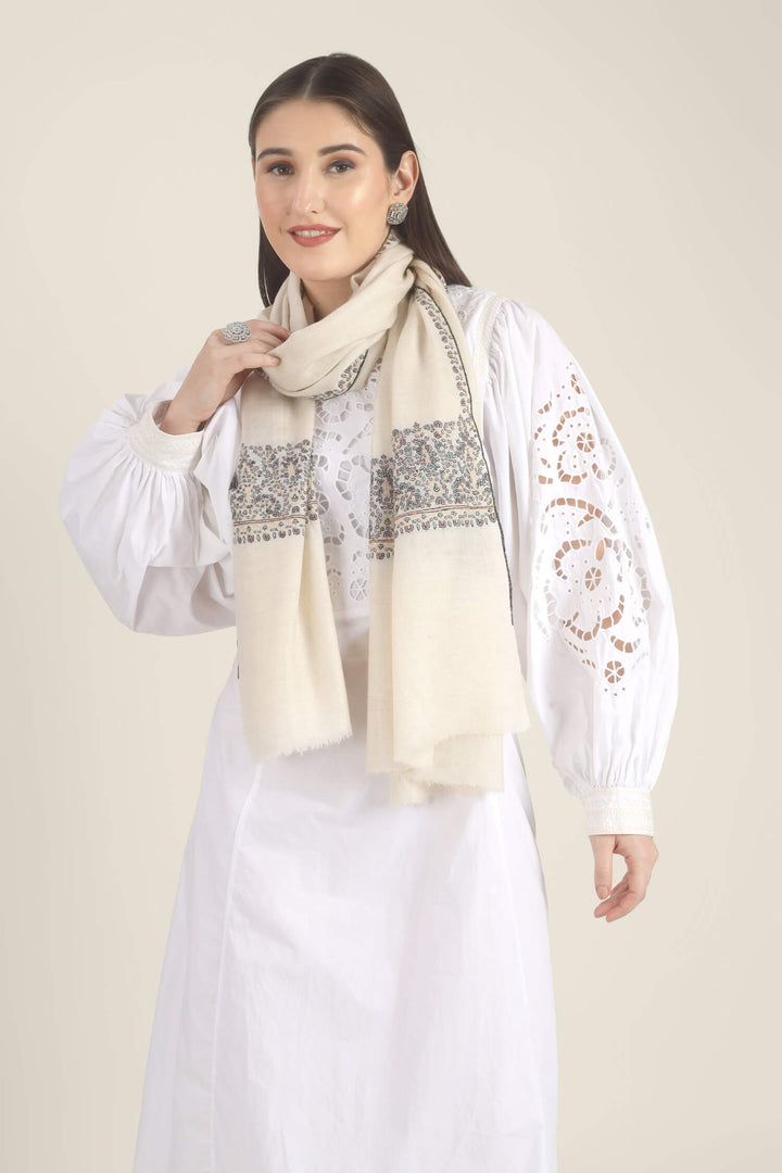 Model wearing a white GI Kashmiri Pure Pashmina stole with multicolour floral Sozni embroidered borders over a white outfit.
    
      | pashmina shawls online | authentic Kashmiri pashmina shawl online | pure pashmina shawl online | original GI certified pashmina shawl online | luxury men's pashmina shawl online from Kashmir | where to buy online pure pashmina in India
    
    | GI Tag Certified - Government-verified authentic Kashmiri Pashmina
    | G20 Official Partner - Selected by India for G20 Summit gifting
    | Handicraft Registered - Official recognition of traditional craftsmanship
    | Certificate of Authenticity - Every purchase includes GI certification