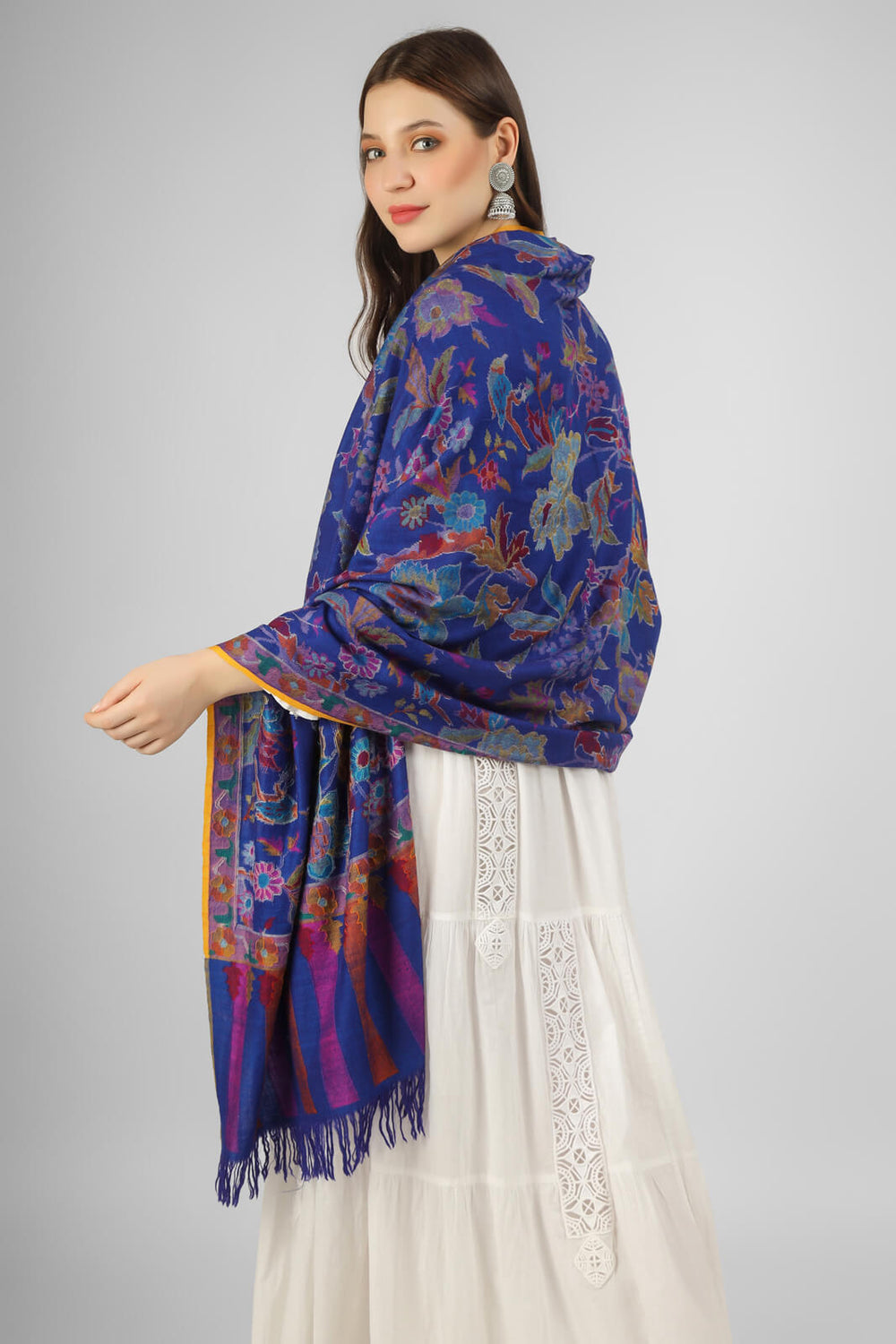 KANI SHAWLS - "This stunning royal blue Kani shawl features a big floral design that is both intricate and eye-catching. Expertly crafted by skilled artisans".you can order from DELHI, DUBAI, LONDON .