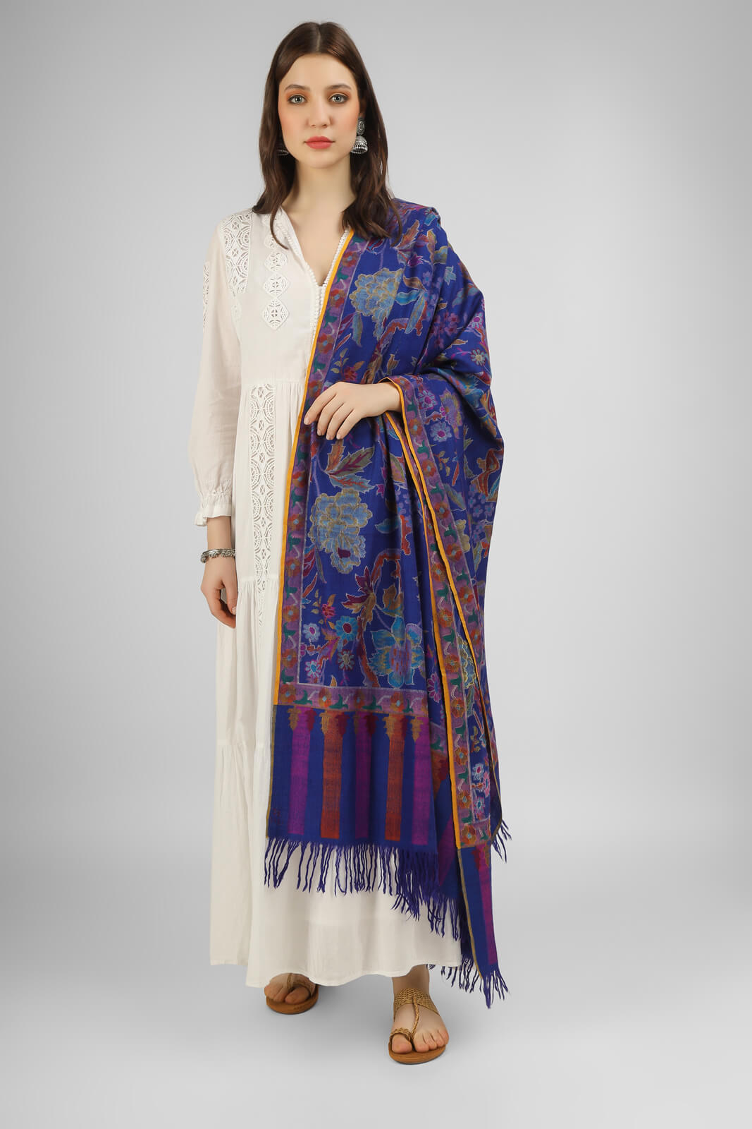 This stunning royal blue Kani shawl features a big floral design that is both intricate and eye-catching. Expertly crafted by skilled artisans, this shawl is made using the traditional Kani weaving technique, which has been passed down for generations. The shawl is made from high-quality pashmina  wool .