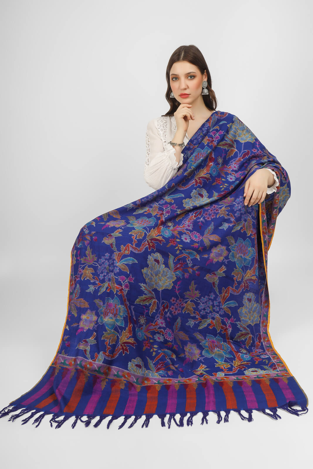 KANI SHAWLS - "This stunning royal blue Kani shawl features a big floral design that is both intricate and eye-catching. Expertly crafted by skilled artisans".you can order from DELHI, DUBAI, LONDON .