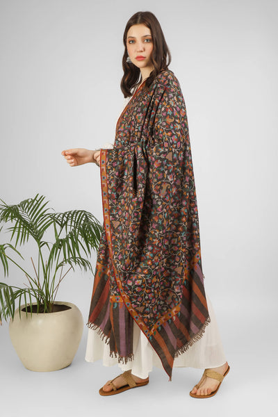 Get wrapped in regal warmth with our exquisite kani weave shawl. Its carbon black base is adorned with a riot of colorful floral motifs, evoking the beauty of nature. Beat the winter blues in style with this cozy and elegant accessory. Shop now to add a touch of grace to your wardrobe
