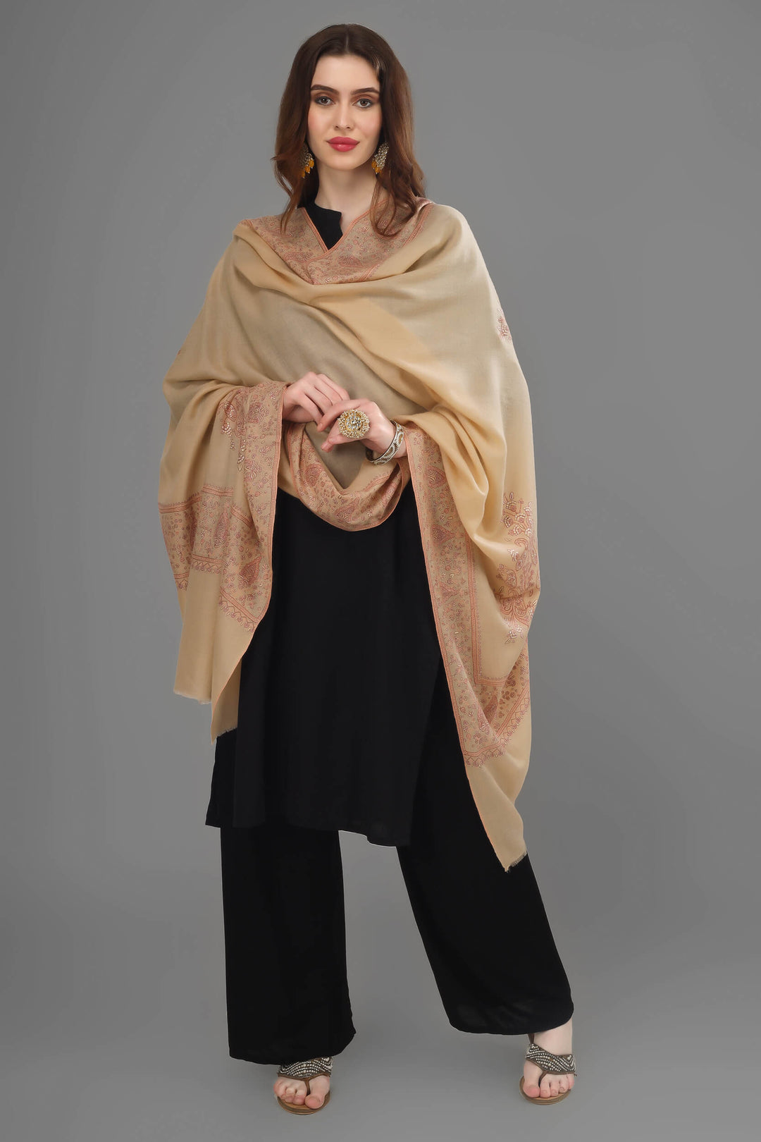 A beige pashmina with fine Sozni Embroidery, traditionally done equally on the four sides of a natural Pashmina Shawl, is known as the Dourdaar pattern. Cherish the eternal warmth, luxury, and elegance of this authentic, handwoven, handloom, handmade, Kashmiri Pashmina Shawl, crafted with exquisite craftsmanship,