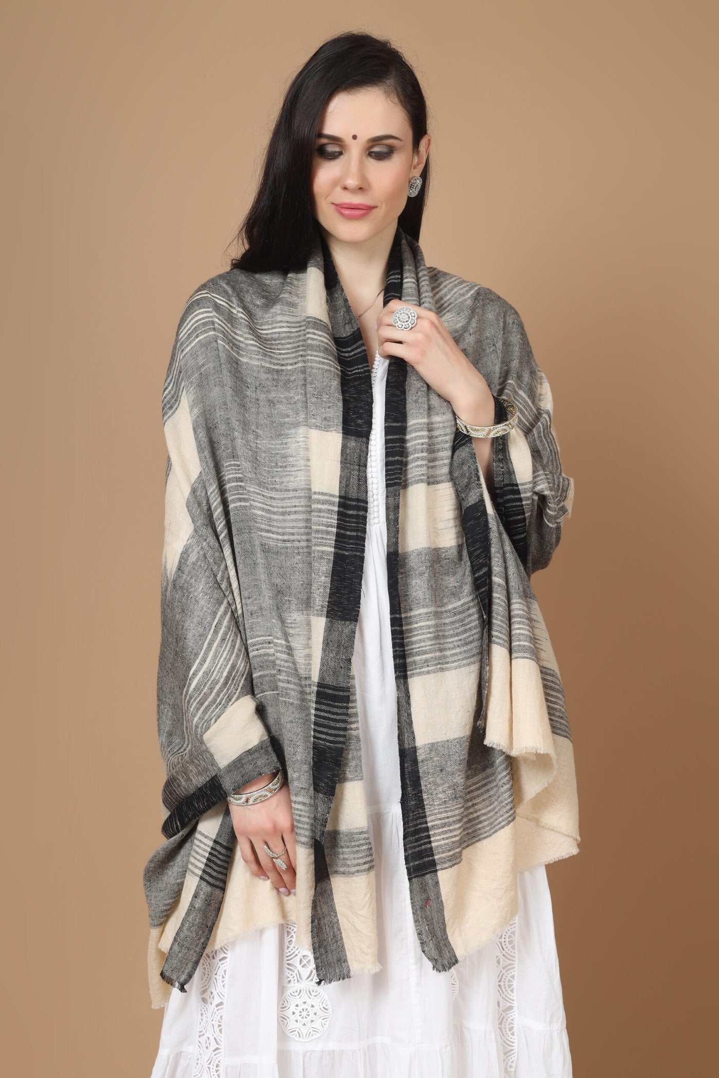 This luxurious, authentic and handmade Pashmina Stole, designed in a Kuwait Ikkat pattern, is crafted by the most talented and skilled Kashmiri Artisans. 