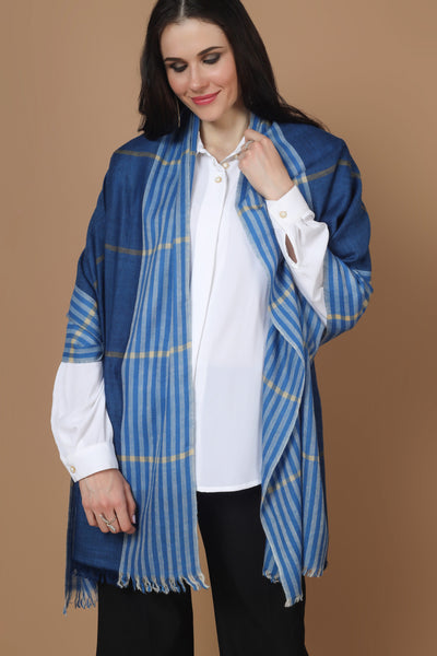 The stole is hand woven in a solid design to complement your winter outfits in the most stylish manner. It has bright blue colours, a fine texture, and a comforting warm touch of the beloved blue Pashmina. Wear the shawl to chilly casual outings or formal gatherings to project a powerful, yet feminine, atmosphere.