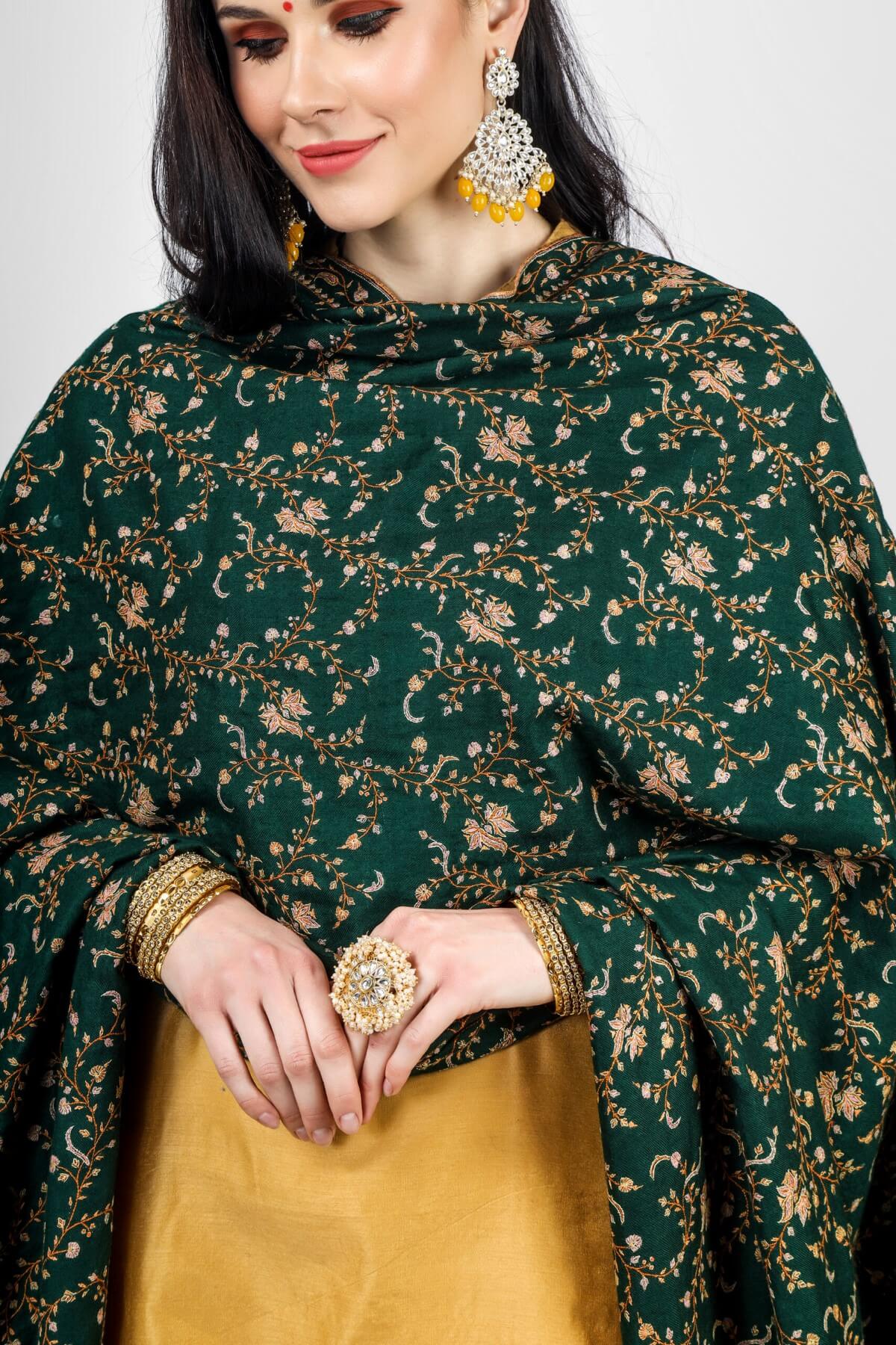 PASHMINA - Overall, the Lotus Green Pashmina Jaldaar Sozni Embroidered Shawl is a beautiful and luxurious piece that can be worn for special occasions or used as a statement piece to elevate any outfit. It also makes for a thoughtful and meaningful gift for a loved one.