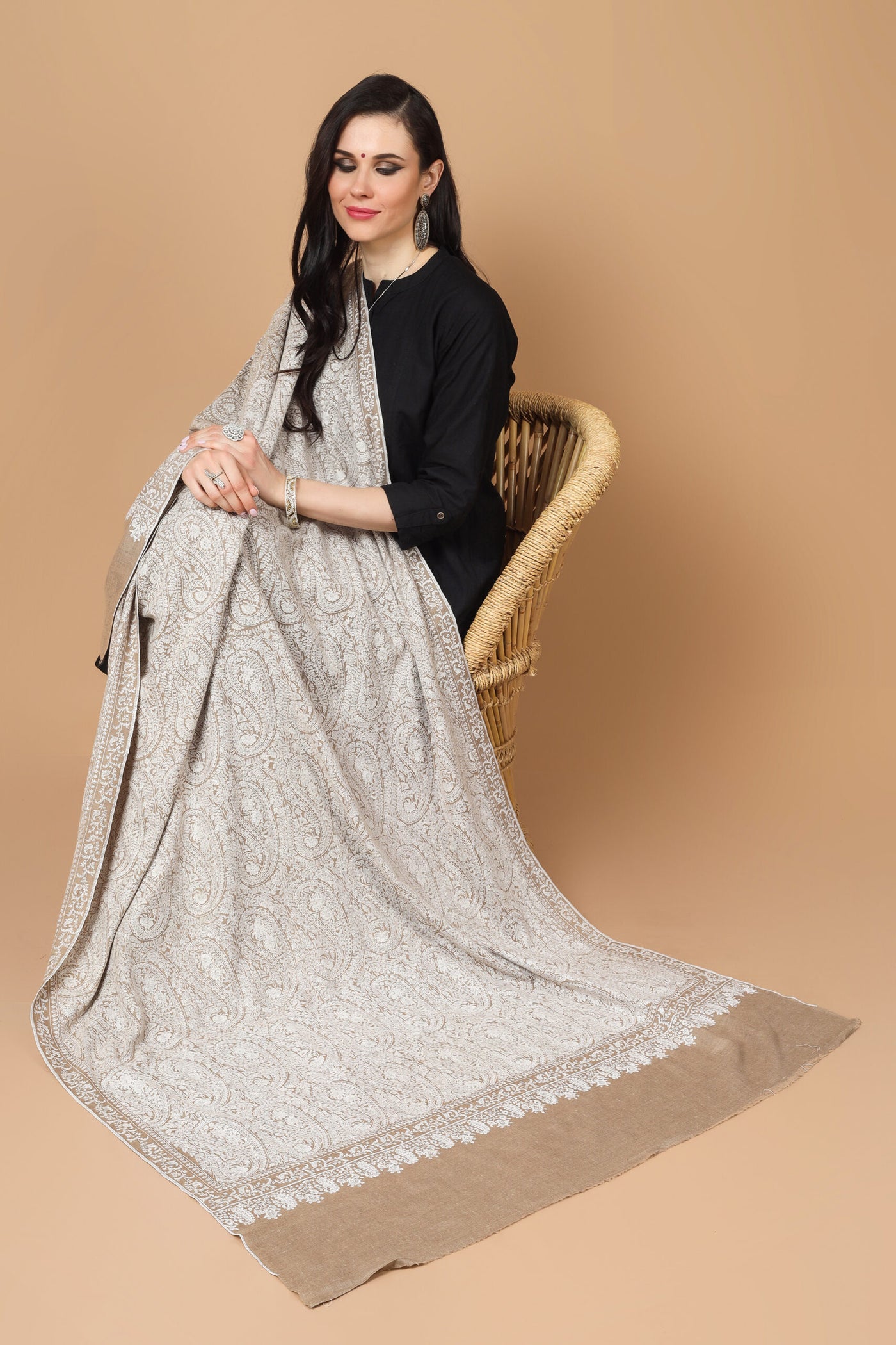  the garment of praise, a versatile piece of art with alluring Sozni embroidery. This natural (khudrang) Pure Pashmina Shawl with white Sozni Jama Hand-Embroidery