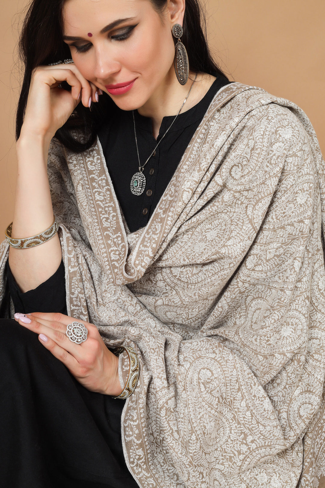  the garment of praise, a versatile piece of art with alluring Sozni embroidery. This natural (khudrang) Pure Pashmina Shawl with white Sozni Jama Hand-Embroidery