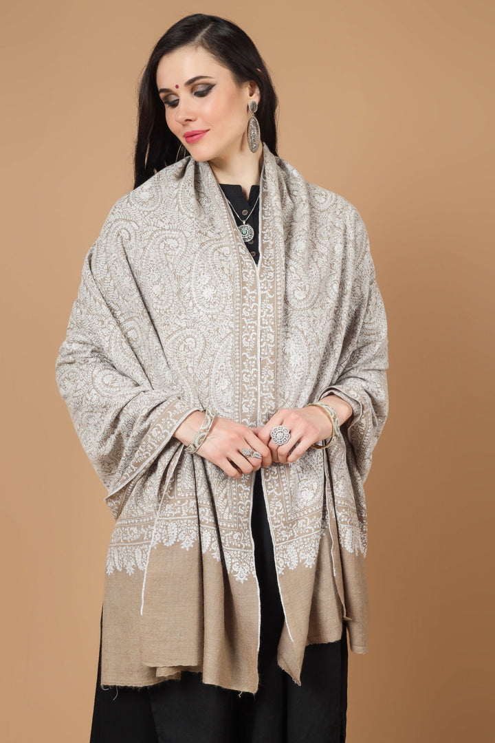  the garment of praise, a versatile piece of art with alluring Sozni embroidery. This natural (khudrang) Pure Pashmina Shawl with white Sozni Jama Hand-Embroidery